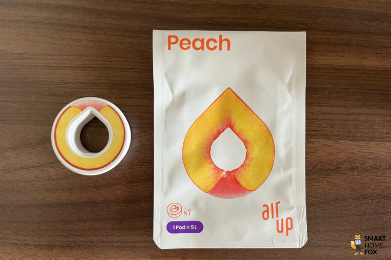Ein Bild, welches den Pod und die Verpackung des Geschmacks Pfirsich zeigt.
