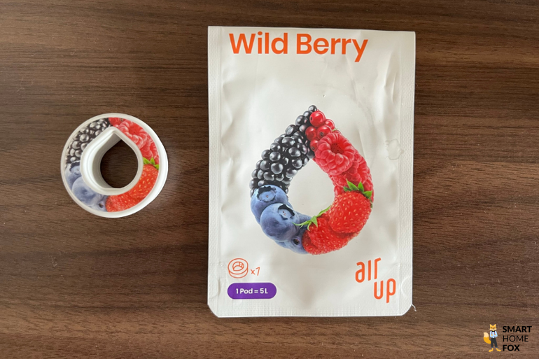 Ein Bild, welches den Pod und die Verpackung des Geschmacks Wild Berry zeigt.
