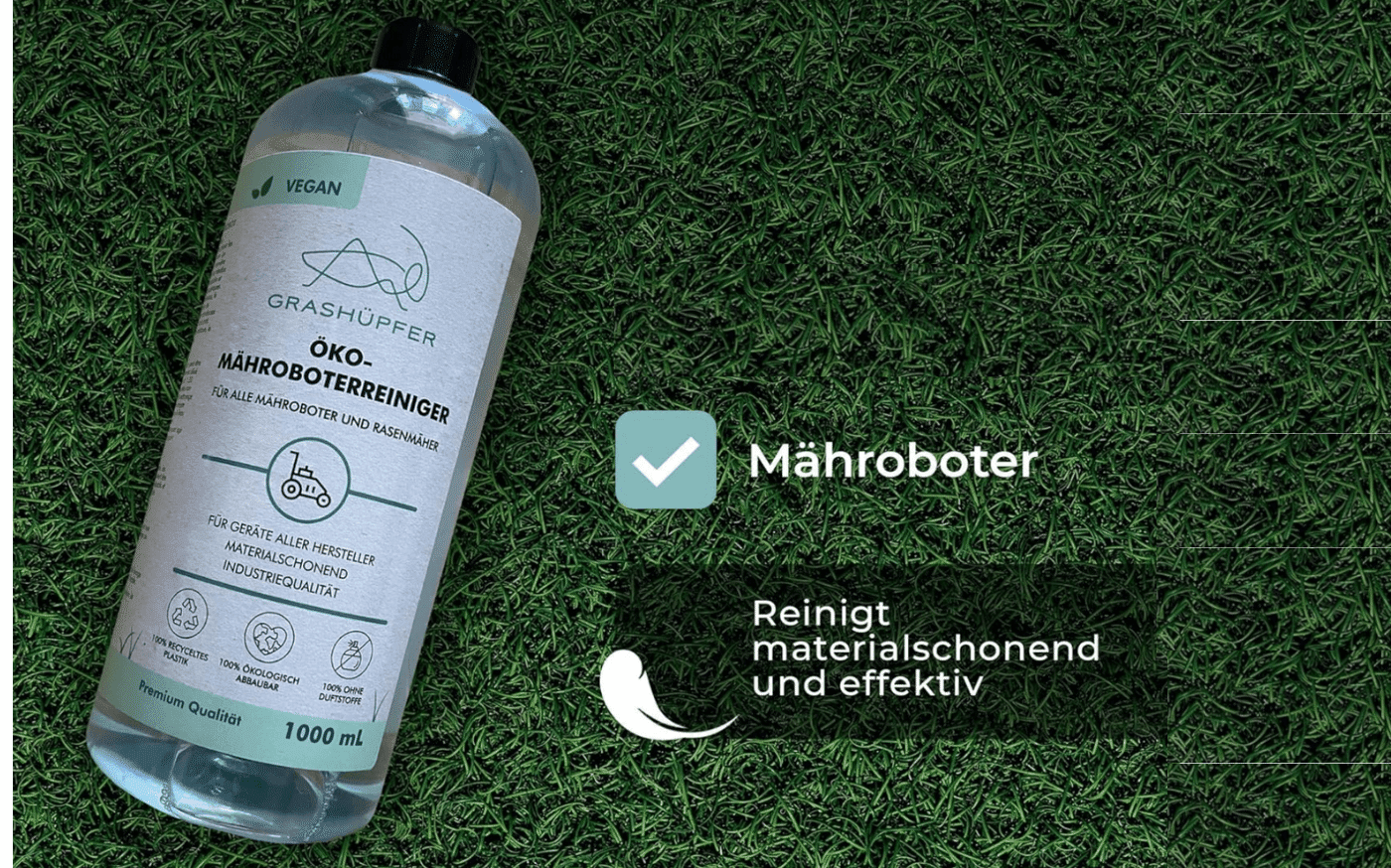 Grashüpfer Mähroboter Reiniger liegt auf einer grünen Wiese.