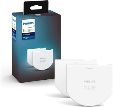 2 Philips Hue Wanschalter sind samt Verpackung vor einem weißen Hintergrund zu sehen